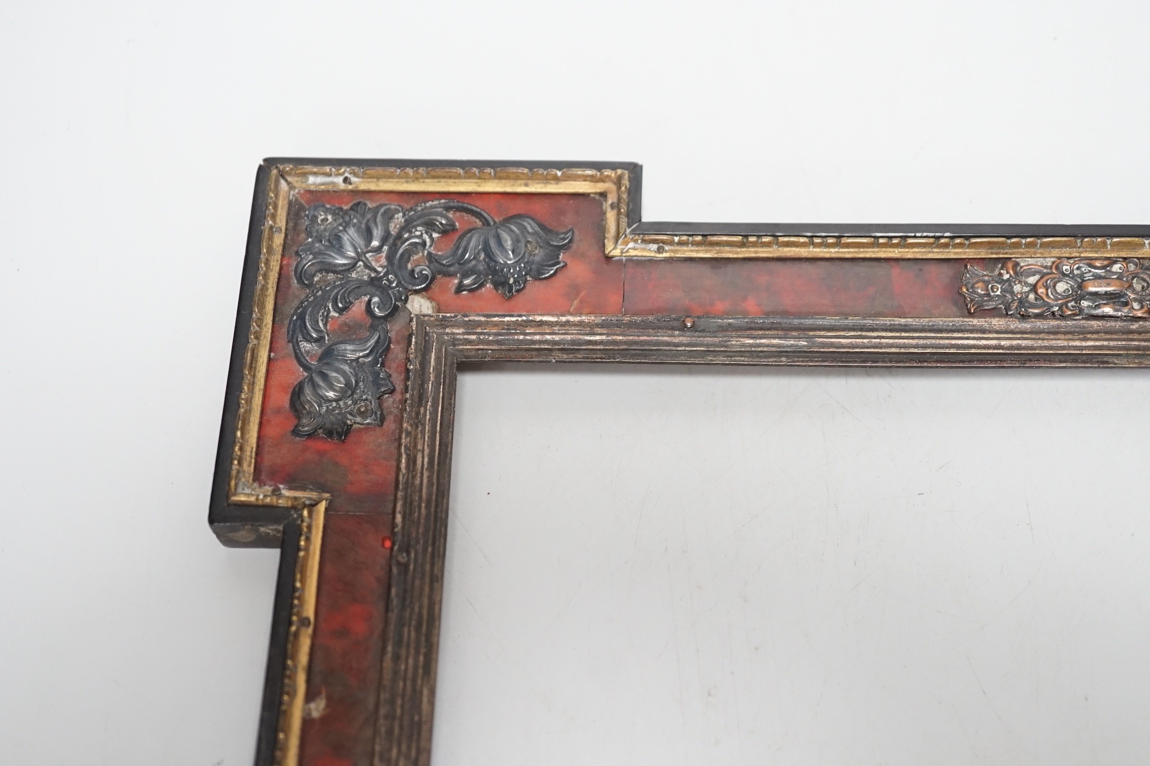 A 19th century red tortoiseshell and metal mounted picture frame. 27 x 31cm